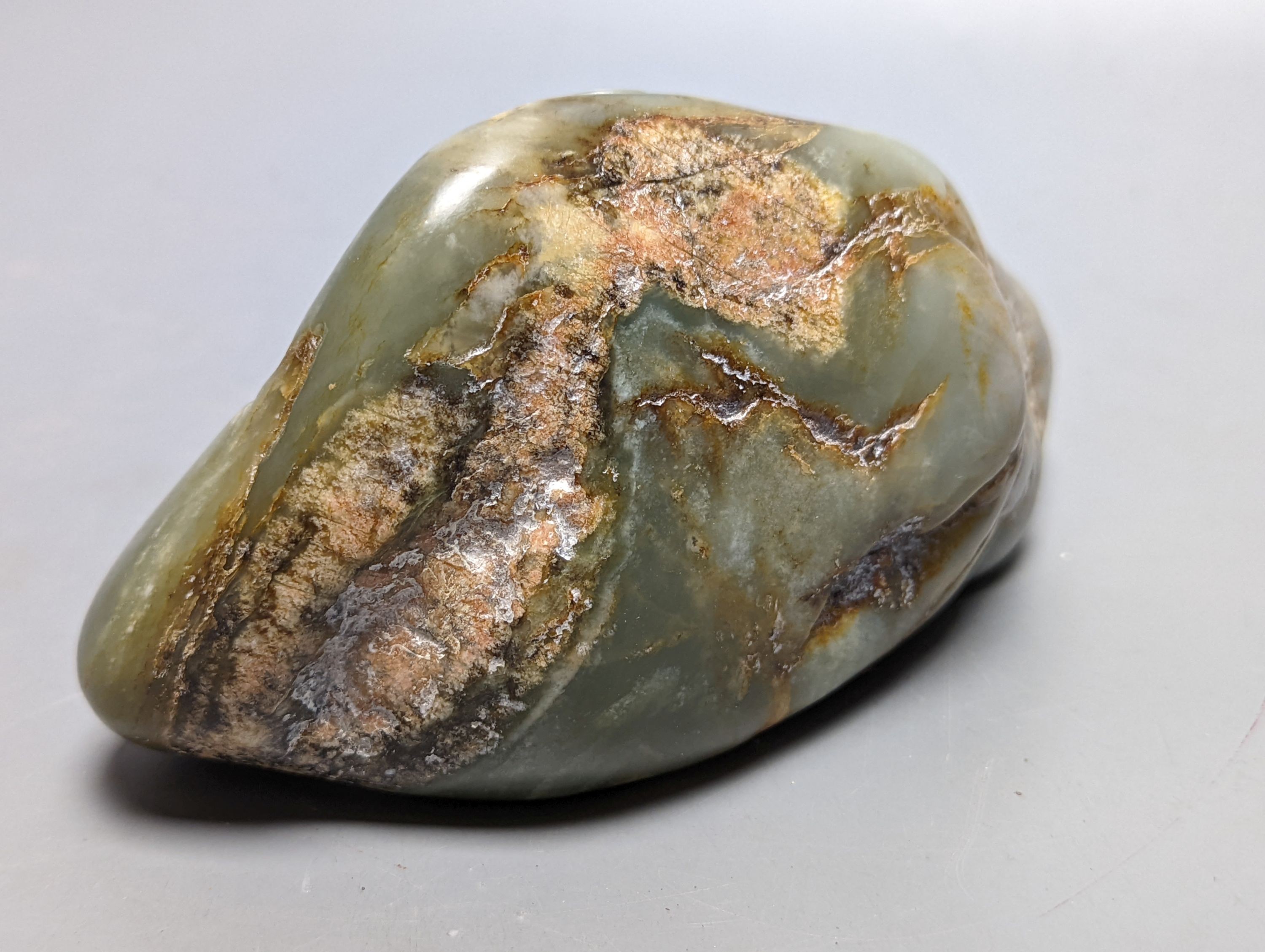 A Chinese celadon and russet jade boulder carving 16cm